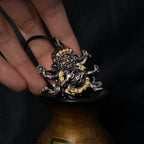 Six-Armed Mahakala Sterling Silver Pendant - Inlaid with Natural Red Agate