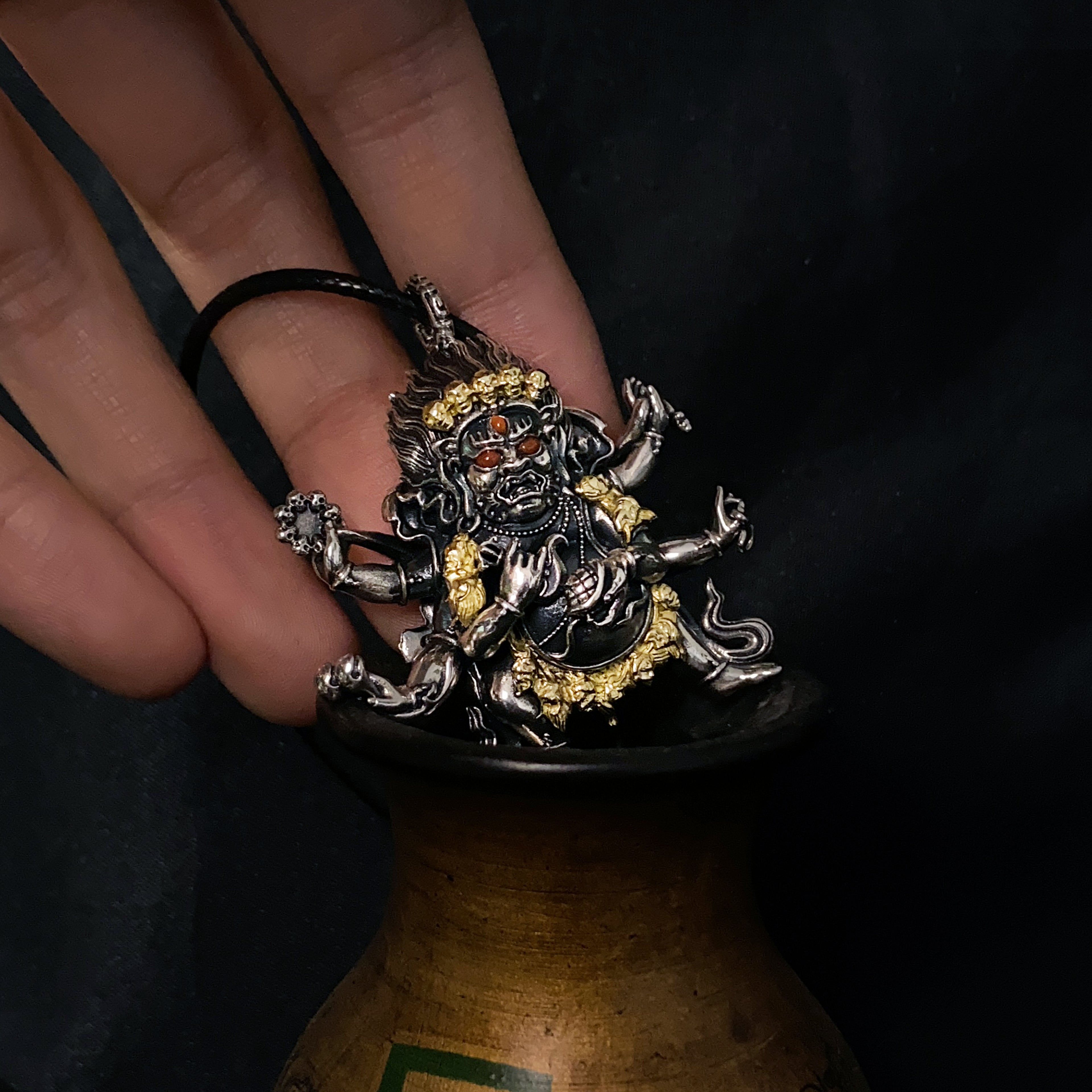 Six-Armed Mahakala Sterling Silver Pendant - Inlaid with Natural Red Agate